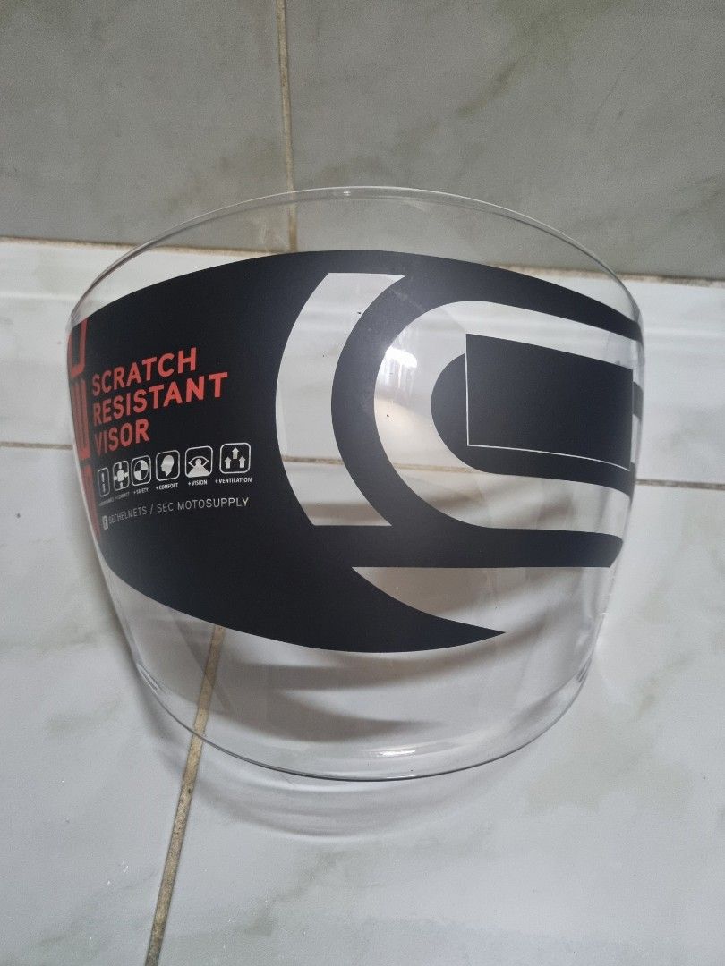 SEC Essential Helmet Visor (Category: Helmets and other Riding Gears) located in Quezon City. Submitted by luckybounce_j8 (Listing ID 1443041150, Image 1). Description: - Clear SEC helmet visor - Not fit sa iba - SEC essential lang - Scratch-resistant coating - Features SEC brand logo - Comes in original plastic packaging - Perfect replacement for your helmet.
