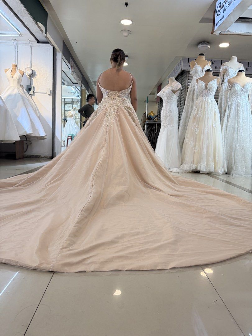 Shangrila Oroque Blush Wedding Gown (Category: Evening dresses & gowns) located in Antipolo. Submitted by yuriwanders (Listing ID 1442967059, Image 2). Description: - Beautiful blush wedding gown from Shangrila Oroque - Intricate lace detailing on the bodice - Dramatic train for a show-stopping entrance - Lace-up back for a customizable fit - Perfect for your dream wedding - Available at Stall 2N-1.