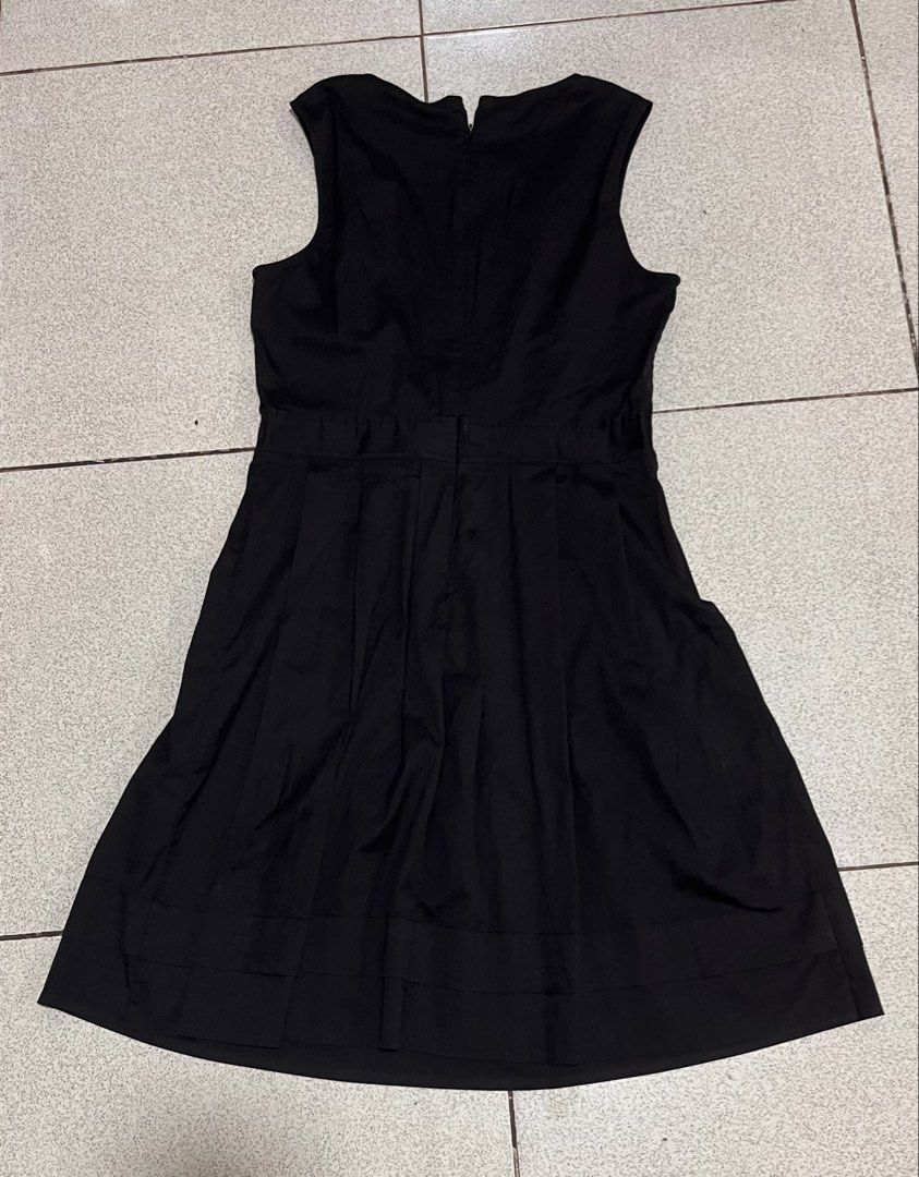 Sleeveless Black A-Line Dress (Category: Dresses) located in Lipa City. Submitted by emscorner (Listing ID 1442961620, Image 2). Description: - Classic black sleeveless dress - Round neckline - Zipper closure at the back - Elasticated waistline - A-line skirt with pleats - Versatile for any occasion.
