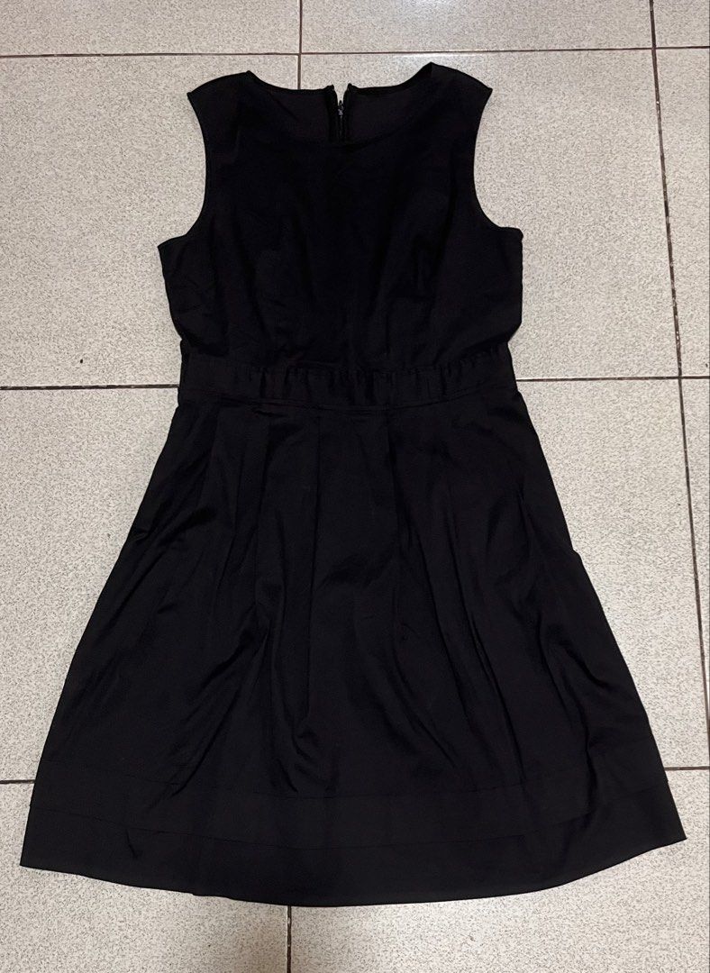 Sleeveless Black A-Line Dress (Category: Dresses) located in Lipa City. Submitted by emscorner (Listing ID 1442961620, Image 1). Description: - Classic black sleeveless dress - Round neckline - Zipper closure at the back - Elasticated waistline - A-line skirt with pleats - Versatile for any occasion.
