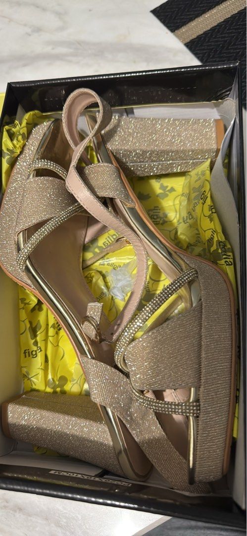 Sparkly Gold Platform Heels with Matching Clutch (Category: Heels) located in Rizal. Submitted by warmfish.f14b30 (Listing ID 1443081152, Image 1). Description: - Sparkly gold platform heels - Glittery finish with rhinestone details on straps - Matching clutch included - Comfortable heel height for events - Comes in original box with tissue paper - Ideal for parties and formal occasions.