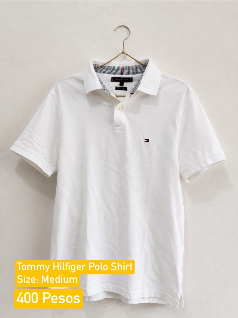 Tommy Hilfiger White Polo Shirt - Medium (Category: Tshirts & Polo Shirts ) located in Manila. Submitted by emmanuelosit (Listing ID 1443060273, Image 1). Description: Declutter Sale from my wardrobe - Classic white Tommy Hilfiger polo shirt - Size: Medium - Iconic Tommy Hilfiger flag logo on chest - Subtle striped detail on collar - Versatile for casual and smart-casual wear - Easy to pair with any bottoms.