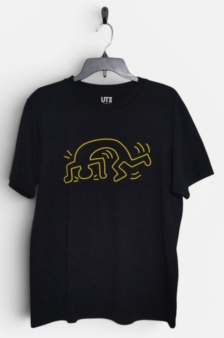 Uniqlo Keith Haring shirt (Category: Tshirts & Polo Shirts ) located in Quezon City. Submitted by schorer (Listing ID 1443066625, Image 1). Description: - Uniqlo UT T-shirt - Color: Black - Graphic: Iconic Keith Haring yellow design - Size: Large 21x28 - Material: 100% Cotton - Style: Comfortable and stylish for everyday wear - Ideal for: Fans of Keith Haring's art.