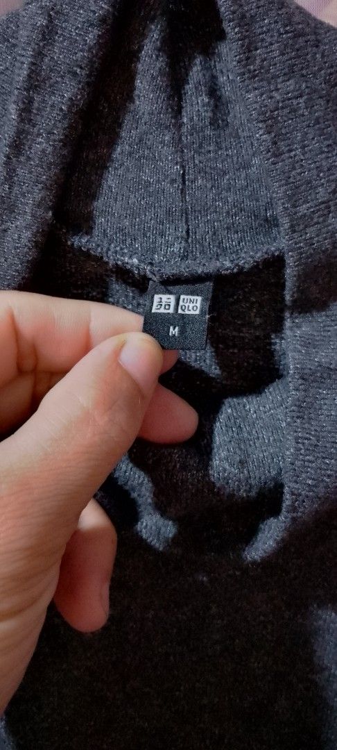 Uniqlo Turtleneck Sweater Long Sleeve Top Size M (Category: Longsleeves) located in Cardona. Submitted by nick_and_maria (Listing ID 1443025650, Image 2). Description: - Uniqlo Turtleneck Sweater - Size: Medium (M) - Color: Dark Teal / Greyish-Blue - Material: Soft fabric - Style: Long sleeves, perfect for layering or wearing alone - A great wardrobe basic.