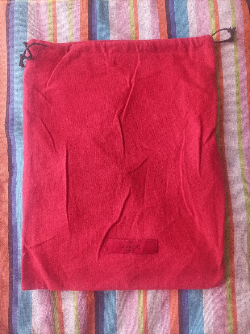 Valentino Red Dust Bag (Category: Luxury Bags & Wallets) located in Pasig City. Submitted by sandacecloset (Listing ID 1442938261, Image 1). Description: - Authentic Valentino dust bag - Color: Red - Closure: Drawstring - Dimensions: Approx. 14 inches x 11 inches - Perfect for protecting handbags or shoes - Clean and ready for use - lining inside.