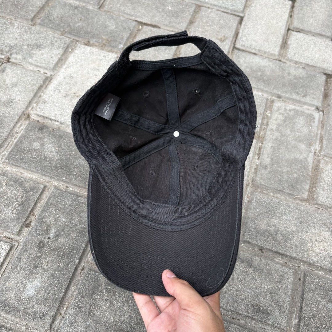 Vetements Haute Couture Reflective Cap (Category: Caps & Hats) located in Naga. Submitted by reshelled (Listing ID 1443027527, Image 3). Description: Condition: Pre-owned, good condition. Minor signs of wear (light fading on the fabric, consistent with normal use). Description: Iconic black dad cap from Vetements. Features bold white reflective “VETEMENTS HAUTE COUTURE” lettering across the front. This minimalist yet statement-making piece is a s