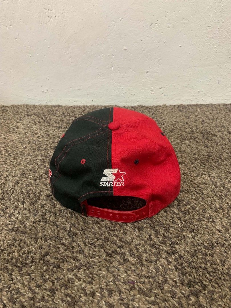 Vintage Chicago Bulls Starter Split Color Snapback Hat (Category: Caps & Hats) located in Mendez-Nunez. Submitted by russs23 (Listing ID 1442958919, Image 3). Description: - Chicago Bulls snapback hat - Split red and black design - Starter brand - Adjustable Snap at the back - Perfect for any Bulls fan - Note: Shows some signs of wear on the inside band.