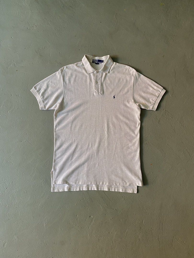 Vintage Ralph Lauren Off White Basic Logo Polo Shirt (Category: Tshirts & Polo Shirts ) located in Quezon City. Submitted by rlphvncntbs (Listing ID 1442997023, Image 1). Description: Vintage Ralph Lauren Off White Basic Logo Polo Shirt Size: Medium Measurements: 21" x 30" (Front Length), 31" (Back Length) Flaws: Small Scratch (Near Hem) ₱1,500 + SF (Negotiable).