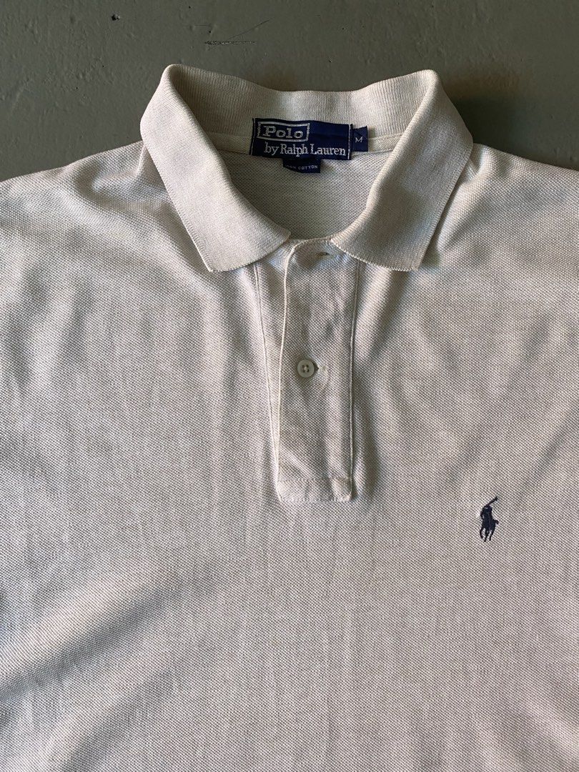 Vintage Ralph Lauren Off White Basic Logo Polo Shirt (Category: Tshirts & Polo Shirts ) located in Quezon City. Submitted by rlphvncntbs (Listing ID 1442997023, Image 2). Description: Vintage Ralph Lauren Off White Basic Logo Polo Shirt Size: Medium Measurements: 21" x 30" (Front Length), 31" (Back Length) Flaws: Small Scratch (Near Hem) ₱1,500 + SF (Negotiable).