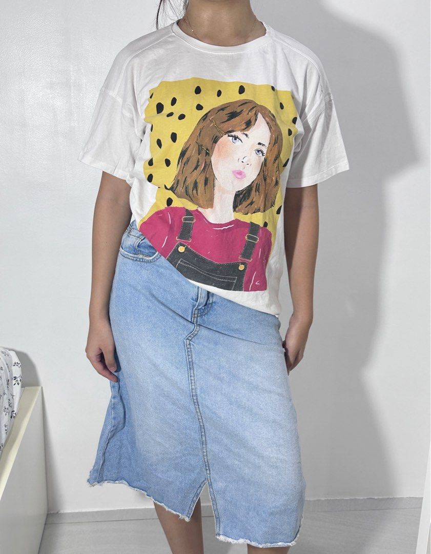 White Graphic Tee with Denim Midi Skirt (Category: Sets or Coordinates) located in Agdangan. Submitted by mvania (Listing ID 1443013496, Image 2). Description: - White t-shirt with a cool graphic print of a girl - Relaxed fit for comfort - Light wash denim midi skirt - Skirt features a raw hem and front slit - Versatile outfit: wear together or separately - Ideal for casual everyday wear.