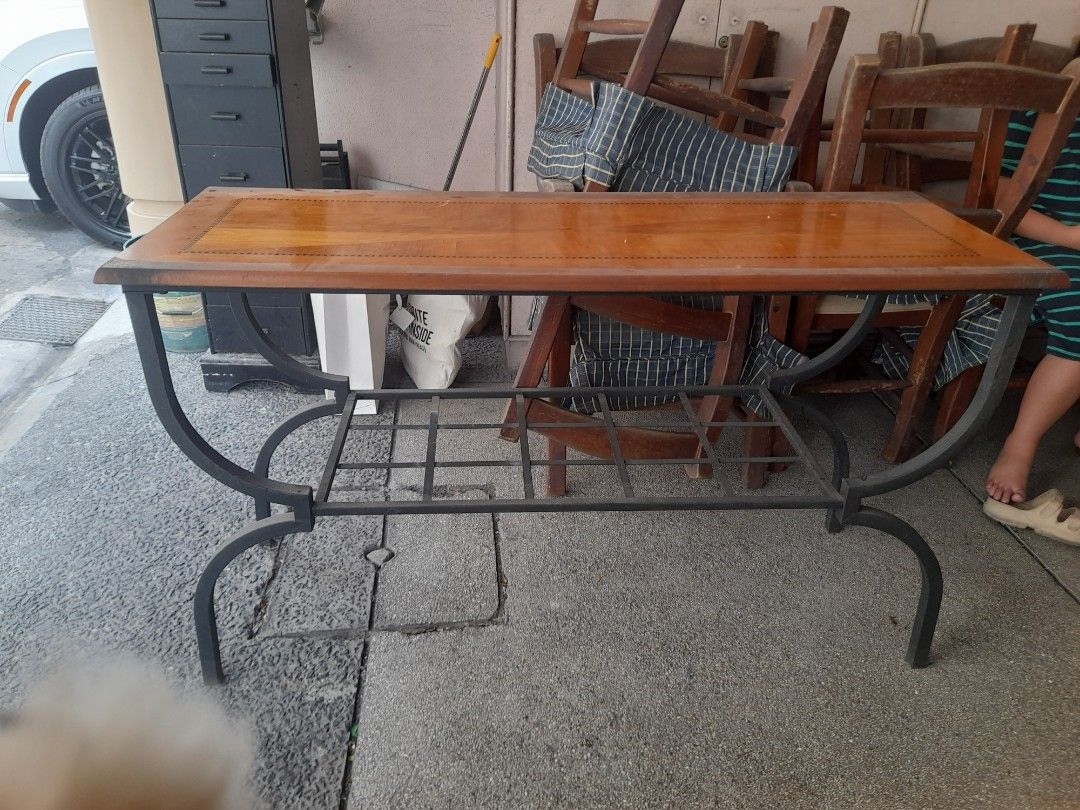 Wooden console table with metal frame (Category: Tables & Sets) located in Valenzuela. Submitted by newbear.425b6e (Listing ID 1442982735, Image 1). Description: - Solid wood console table - Decorative curved metal frame - Beautiful wood grain pattern - Good size for living rooms - Minor wear on wood surface - Selling because of redecoration -surplus.