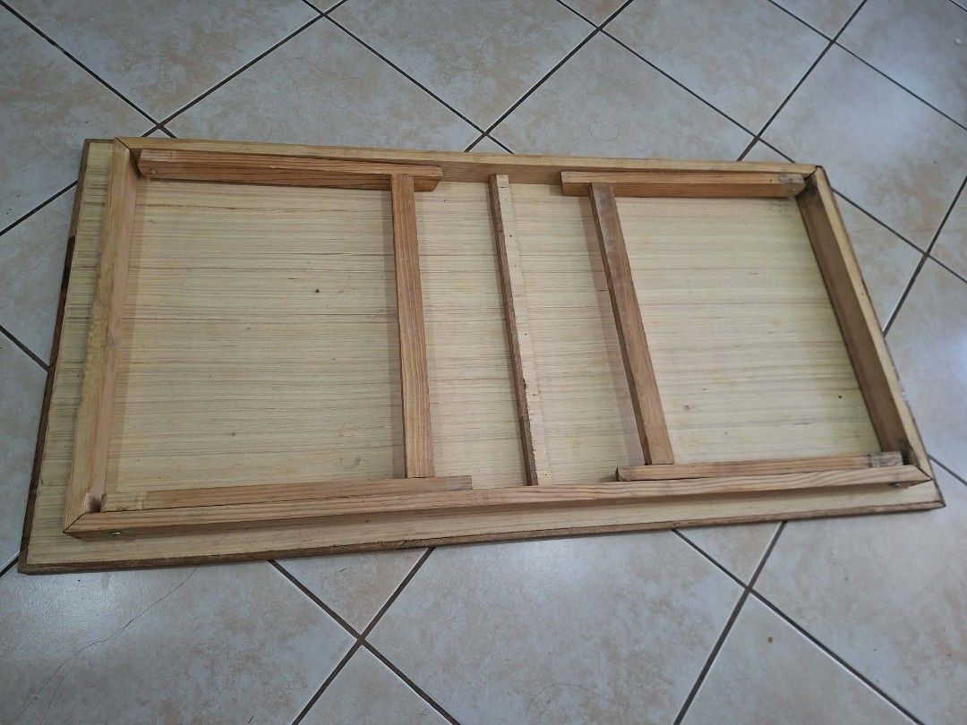 Wooden Foldable Tray Table (Category: Tables & Sets) located in Pasay City. Submitted by colektura (Listing ID 1443044559, Image 2). Description: - long wooden bedside table with foldable legs - Ideal for breakfast in bed or as a portable workspace - Legs fold flat for convenient storage.