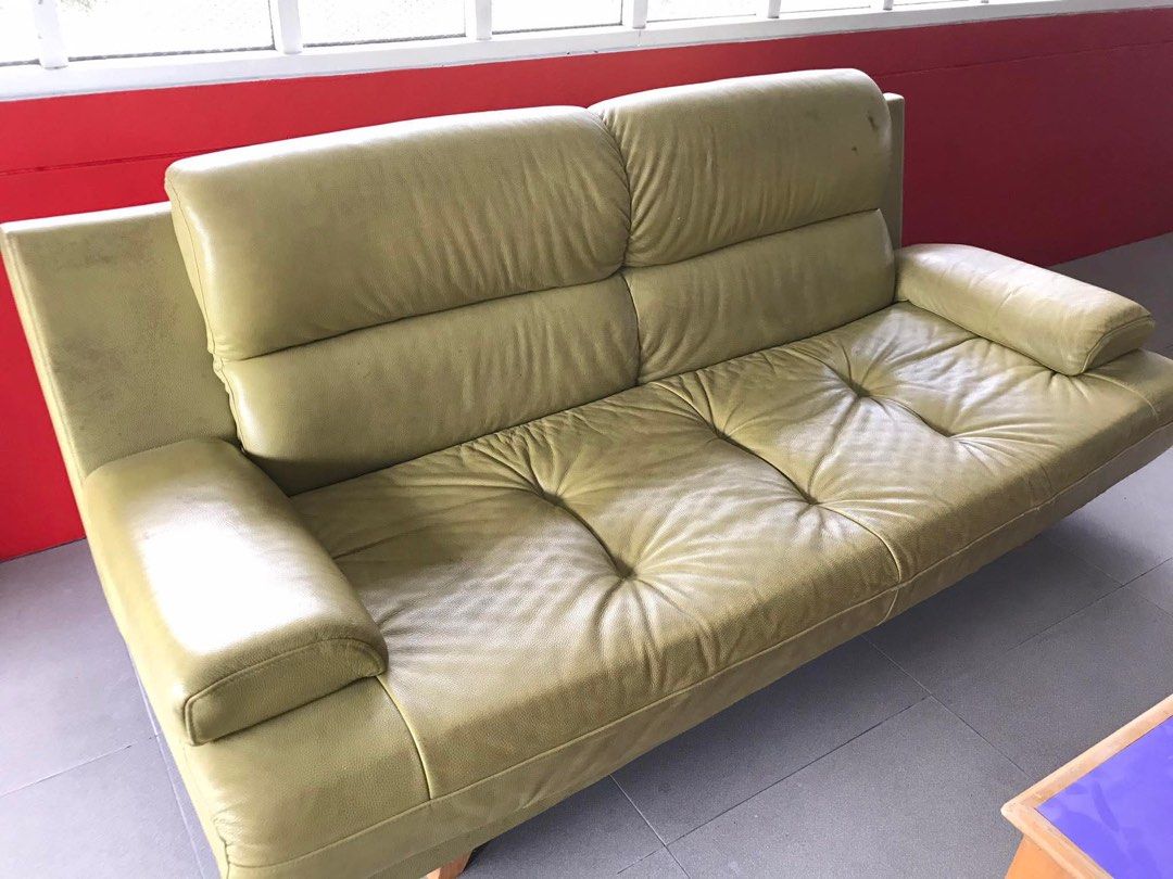 Yellow Green Leather Sofa (Category: Sofas) located in Manila. Submitted by jeffcay (Listing ID 1441472535, Image 2). Description: - Bright yellow green 3-seater leather sofa - Comfortable with wide armrests - Features stylish tufted cushions - Shows minor signs of wear on the leather - Overall in good, usable condition - Ideal for living rooms or lounge areas .