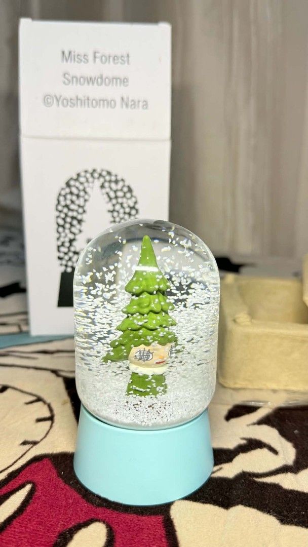 Yoshitomo Nara Miss Forest Snowdome (Category: Designer & Blind Box Toys) located in Valenzuela. Submitted by S0AP_1982 (Listing ID 1443052268, Image 2). Description: - Yoshitomo Nara Miss Forest Snowdome - Adorable little tree character inside - Shake to create a beautiful snow effect - Comes with its original packaging - Highly collectible item for fans of Yoshitomo Nara's art - Only 2pcs available left.