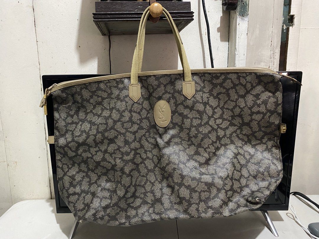 Yves Saint Laurent YSL Monogram Tote Bag (Category: Luxury Bags & Wallets) located in Manila. Submitted by resi.diaz (Listing ID 1443001002, Image 1). Description: - Bought from Surplus. Not professionally authenticated. - Sold as is. - Iconic YSL Monogram Print All Over - Beige Leather Trim and Handles - Gold Tone Hardware with YSL Logo Charm - Secure Zipper Closure - Ideal for Travel or Everyday Use - Shows some signs of wear on hardware and le