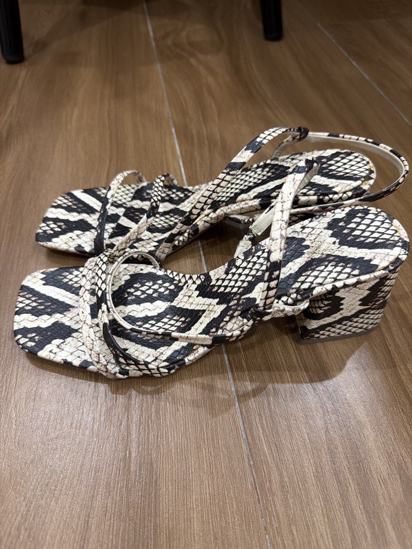 Zara Snake Print Block Heel Sandals (Category: Flats & Sandals) located in Manila. Submitted by airaaaaaamae12 (Listing ID 1442967856, Image 1). Description: - Zara sandals - Cool snake print design - Comfortable block heel - Stylish strappy silhouette - Size: 38 EUR - Perfect for dressing up or down.