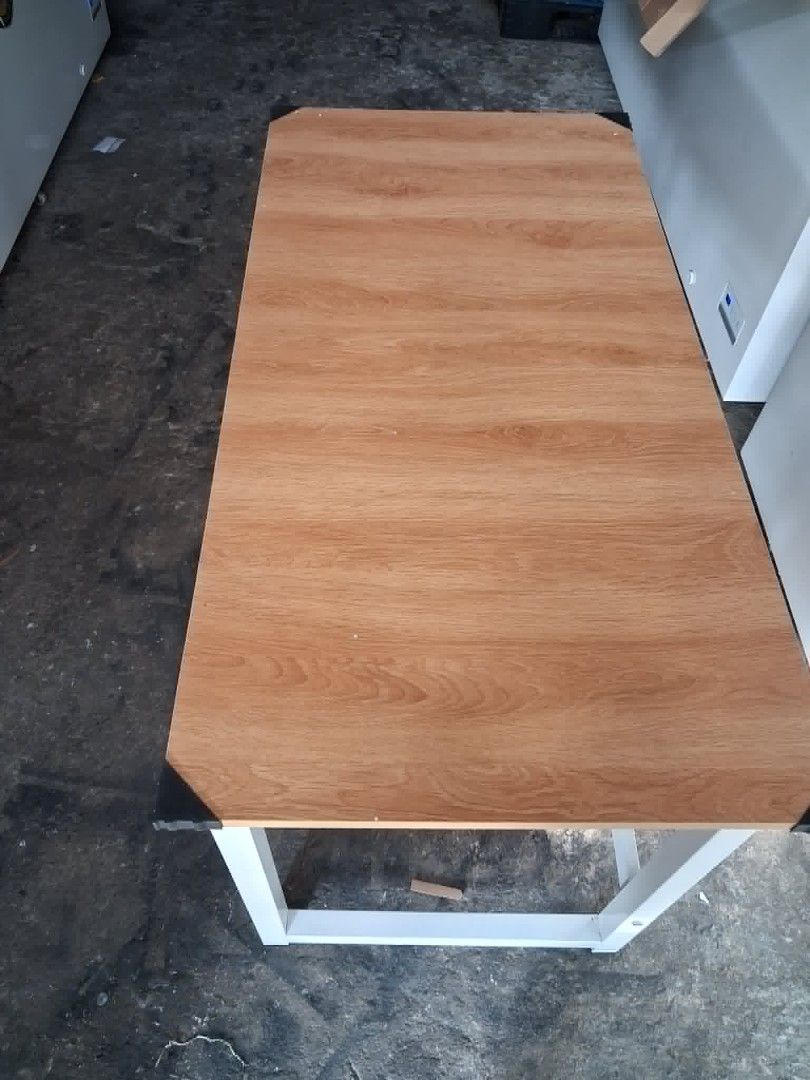 120x60x74cm computer desk (Category: Tables & Sets) located in Manila. Submitted by mightycloud_1992 (Listing ID 1443127714, Image 3). Description: - Light wood grain table top - Sturdy white metal legs - Ideal for small workspaces or as an extra surface - Good, sturdy construction - Ready for a new home!.