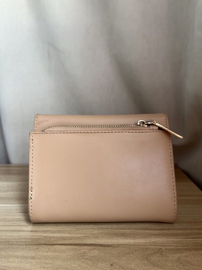 AK Anne Klein Tri-Fold Wallet (Category: Wallets & Card holders) located in Dumaguete. Submitted by deklutterfly (Listing ID 1443182958, Image 3). Description: Decluttering 🛍️ Everything must go 💖 AK Anne Klein Tri-Fold Wallet - Tri-fold wallet in a versatile beige/tan color - Bought from Zalora at Php 2k+ - Elegant gold-tone hardware with a secure twist-lock closure - Practical interior with multiple card slots and a zippered pocket for coins,