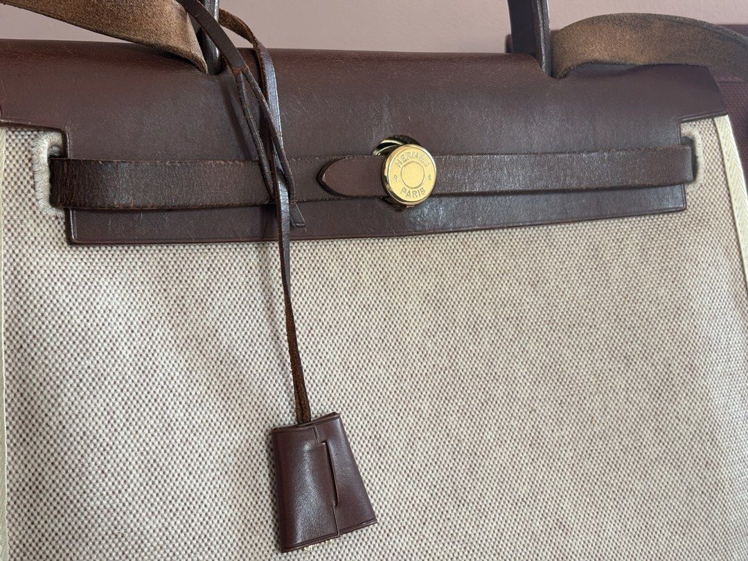 Authentic Hermes Herbag Bag‼️ (Category: Luxury Bags & Wallets) located in Makati City. Submitted by nearly-new (Listing ID 1443212101, Image 3). Description: VERY GOOD DEAL‼️ Hermès Herbag 31 in natural canvas with brown leather trim and gold hardware. Includes the removable shoulder strap and an additional interchangeable Herbag canvas body in a different color. Would be delighted to arrange a viewing for serious buyers to appreciate the detail