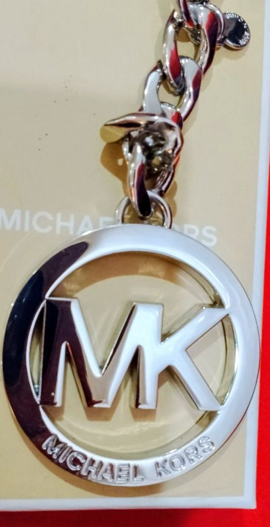 Authentic Michael Kors MK Logo Keychain (Silver) (Category: Luxury Bags & Wallets) located in Pasig City. Submitted by emerald712 (Listing ID 1443224542, Image 3). Description: New in its original Tag nd Box Michael Kors MK logo Silver Keychain.