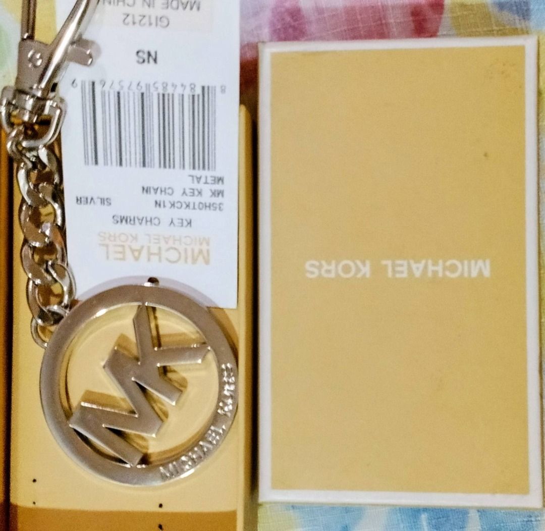 Authentic Michael Kors MK Logo Keychain (Silver) (Category: Luxury Bags & Wallets) located in Pasig City. Submitted by emerald712 (Listing ID 1443224542, Image 2). Description: New in its original Tag nd Box Michael Kors MK logo Silver Keychain.