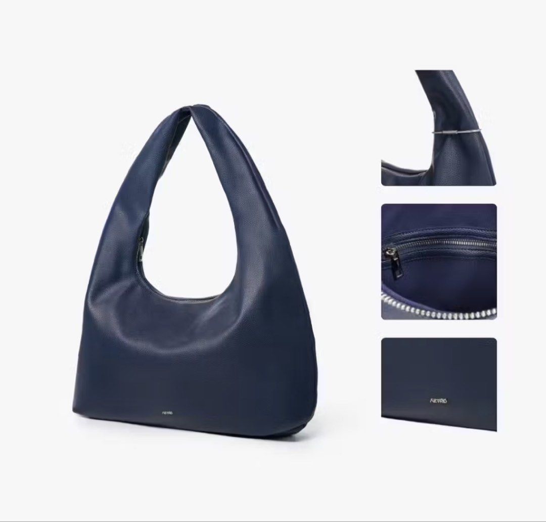 AZTRID Extra Large XL - Navy Blue Hobo Bag (Category: Shoulder Bags) located in Manila. Submitted by imda1 (Listing ID 1443284968, Image 1). Description: - Brand: AZTRID - Color: Navy Blue - Size: XL (can fit up to 15” laptop) - Material: Textured Faux Leather - Closure: Zipper top - Condition: like new, logo on the main bag was removed, see actual photo posted - Includes: Original box and dust bag .