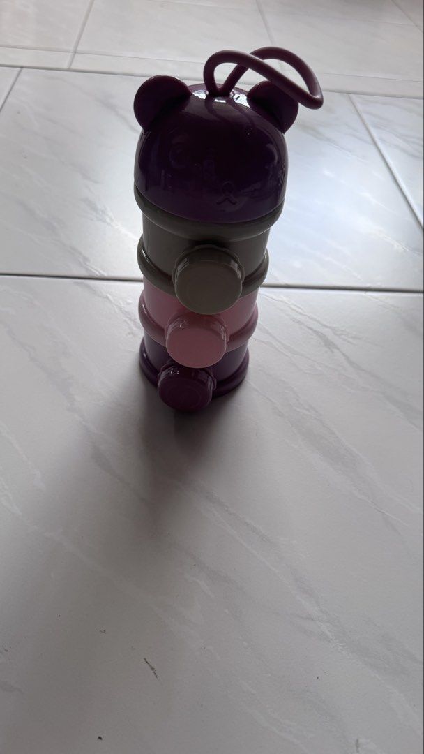 Bear Stackable Formula Dispenser (Category: Breastfeeding & Bottle Feeding) located in Singapore. Submitted by audreytan188 (Listing ID 1443249498, Image 1). Description: - Cute bear-shaped design - 3 stackable compartments - Perfect for on-the-go feeding - Easy to carry with loop handle - Available in purple, grey, and pink - Stores milk powder or snacks.
