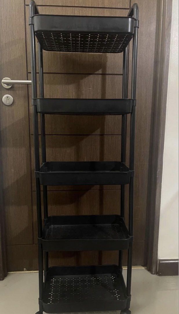 Black 5-Tier Rolling Storage Cart with Wheels (Category: Storage Boxes & Baskets) located in Manila. Submitted by ghieuy (Listing ID 1443278064, Image 2). Description: - Sleek black 5-tier storage cart - Convenient wheels for easy mobility - Perforated bases on each tier for ventilation - Sturdy and durable plastic construction - Ideal for organizing any space in your home - Approximate dimensions: 15" W x 35" H x 10" D - Ready to declutter your 