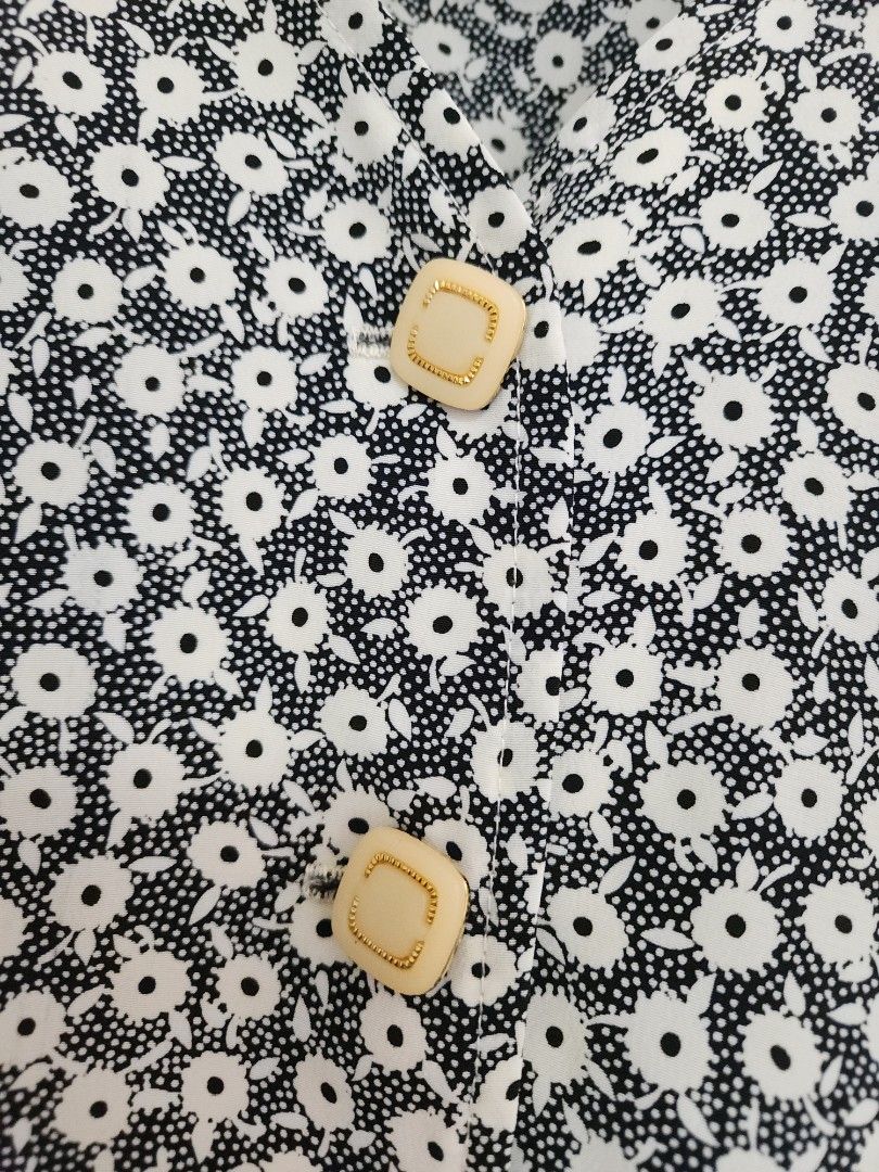 Vintage Floral Button-Up Blouse (Category: Blouses) located in Makati City. Submitted by abbydeclutters (Listing ID 1443293013, Image 3). Description: Vintage black and white floral blouse w/ cute buttons. Was my mom's from the 90s. Still feels newish. Fits til medium.