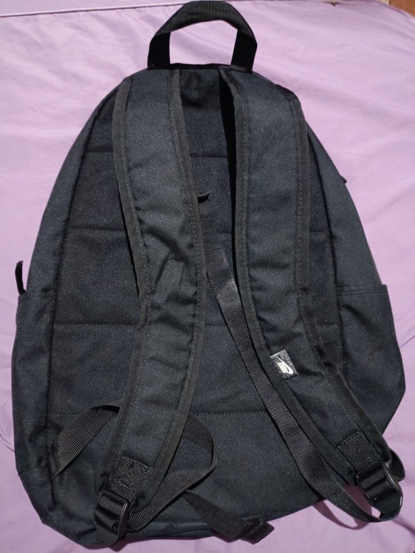 Black Nike Backpack with Large White Swoosh Logo (Category: Backpacks) located in Manila. Submitted by parcanon (Listing ID 1443151718, Image 2). Description: - Classic black Nike backpack - Iconic large white Swoosh logo - Spacious main compartment for essentials - Convenient side pockets for water bottles or quick access items - Adjustable shoulder straps for comfortable carrying - Ideal for school, gym, or everyday use -issue print .