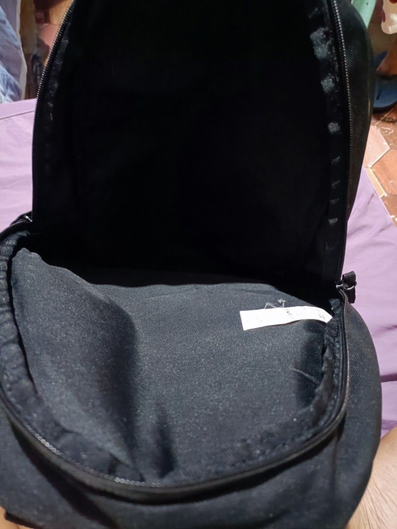 Black Nike Backpack with Large White Swoosh Logo (Category: Backpacks) located in Manila. Submitted by parcanon (Listing ID 1443151718, Image 3). Description: - Classic black Nike backpack - Iconic large white Swoosh logo - Spacious main compartment for essentials - Convenient side pockets for water bottles or quick access items - Adjustable shoulder straps for comfortable carrying - Ideal for school, gym, or everyday use -issue print .