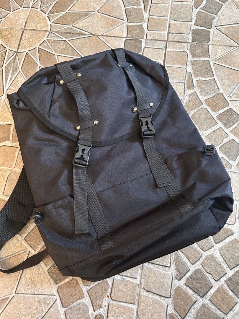 Black Roll Top Backpack with Buckle Straps (Category: Backpacks) located in Taguig. Submitted by rjfp.0214 (Listing ID 1443126258, Image 1). Description: - Sleek black roll top backpack - Secure buckle straps on the front - Comfortable padded shoulder straps - Main compartment with drawstring closure - Additional zippered pocket on the back - Ideal for everyday use and travel.