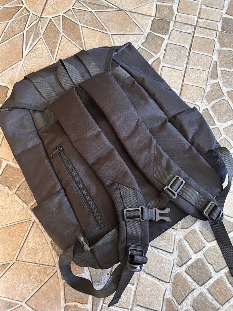 Black Roll Top Backpack with Buckle Straps (Category: Backpacks) located in Taguig. Submitted by rjfp.0214 (Listing ID 1443126258, Image 2). Description: - Sleek black roll top backpack - Secure buckle straps on the front - Comfortable padded shoulder straps - Main compartment with drawstring closure - Additional zippered pocket on the back - Ideal for everyday use and travel.