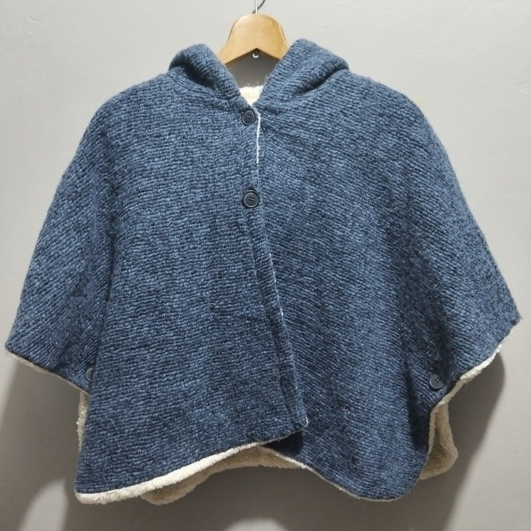 Blue Knit Hooded Poncho with Sherpa Lining (Category: Babies & Kids Fashion) located in Quezon City. Submitted by heybailey (Listing ID 1443215833, Image 1). Description: - Cozy blue knit poncho - Features a warm hood - Lined with soft sherpa for extra comfort - Convenient button closures on front and sides - Ideal for layering during cooler weather - Effortless casual style.