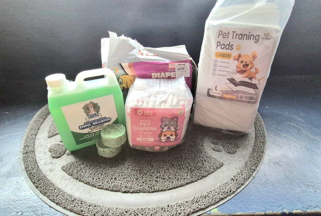 Bundle of pet shampoo, diaper, training pads and mat (Category: Health & Grooming) located in Caloocan City. Submitted by celonessentials (Listing ID 1443220902, Image 1). Description: my dog passed away just last week, hence selling all her grooming essentials: 1. Liquid Shampoo and body soap bar (unused) 2. Small female diaper 12pcs (unused) 3. Medium 10pcs diaper (opened) 4. Pet training pads L , i think 30pcs na lang 5. floor mat (for their b