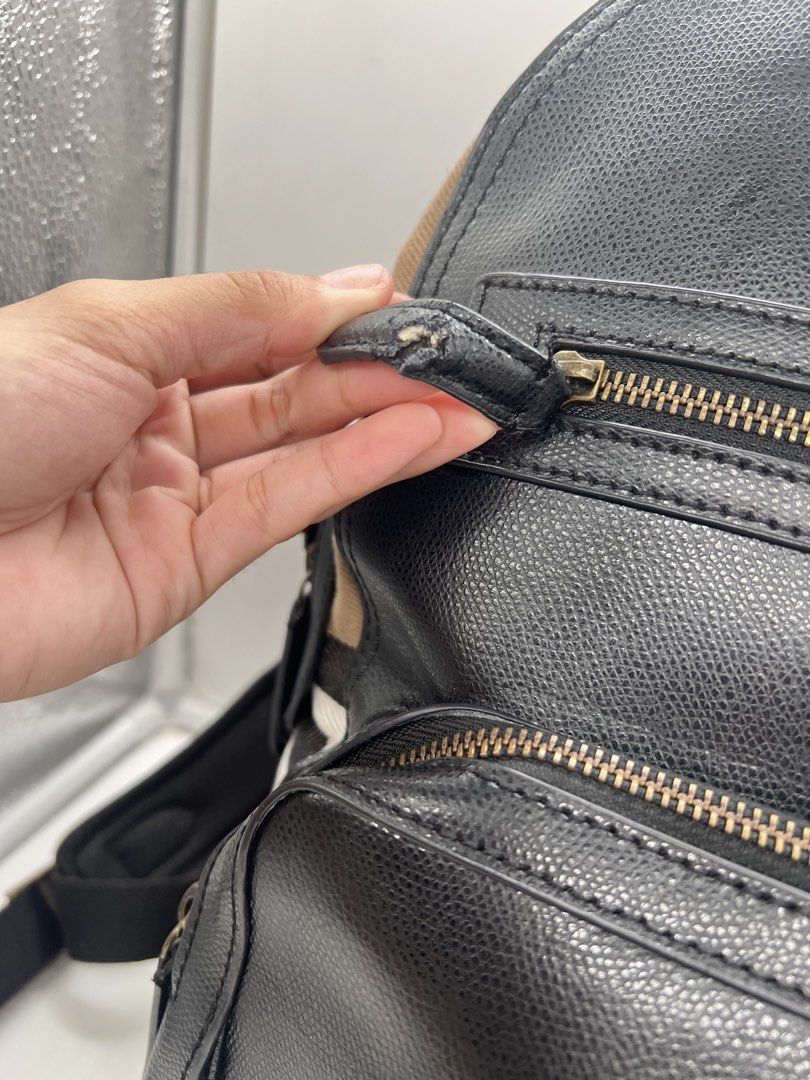 Burberry Textured Leather and House Check backpack (Category: Backpacks) located in Cavite. Submitted by aellavier (Listing ID 1443221755, Image 2). Description: orig preloved. cut leather puller, peeling leather at the top handle. manageable flaws, still usable condition. that's why priced low .