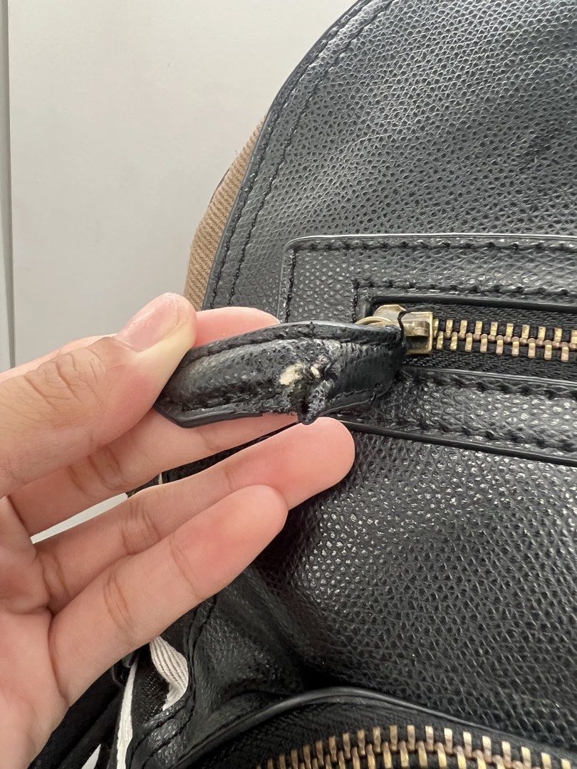 Burberry Textured Leather and House Check backpack (Category: Backpacks) located in Cavite. Submitted by aellavier (Listing ID 1443221755, Image 3). Description: orig preloved. cut leather puller, peeling leather at the top handle. manageable flaws, still usable condition. that's why priced low .