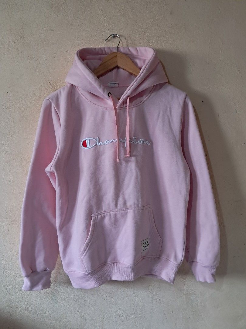 Champion Pink Hoodie (Category: Coats, Jackets and Outerwear) located in Silang. Submitted by segundalifestyle (Listing ID 1443258782, Image 1). Description: - Classic pink Champion hoodie - Embroidered Champion logo on front - Pink drawstrings for hood - Made from soft, comfortable material - Ideal for everyday casual wear - 19 x 24 inches Dimension .