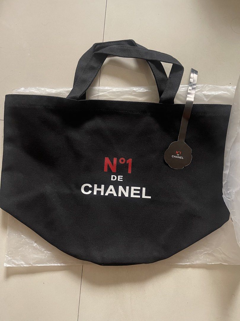Chanel N°1 De Chanel Canvas Tote Bag (Category: Luxury Bags & Wallets) located in Quezon City. Submitted by kingcurator (Listing ID 1443219230, Image 1). Description: - gift with purchace N°1 De Chanel canvas tote bag - Features the N°1 De Chanel logo on one side - Adorned with a red camellia flower on the other side - Made from 100% high-quality cotton - Includes a convenient inner pocket - Comes with its original tag - Ideal for everyday use an