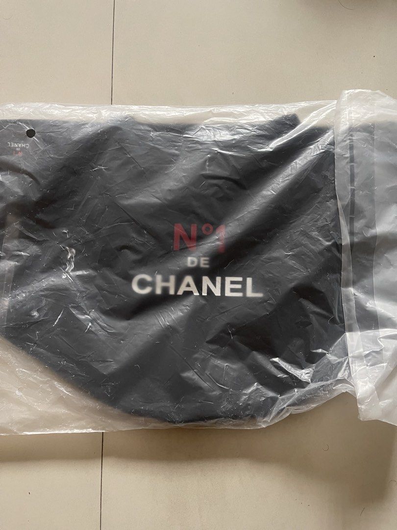 Chanel N°1 De Chanel Canvas Tote Bag (Category: Luxury Bags & Wallets) located in Quezon City. Submitted by kingcurator (Listing ID 1443219230, Image 2). Description: - gift with purchace N°1 De Chanel canvas tote bag - Features the N°1 De Chanel logo on one side - Adorned with a red camellia flower on the other side - Made from 100% high-quality cotton - Includes a convenient inner pocket - Comes with its original tag - Ideal for everyday use an