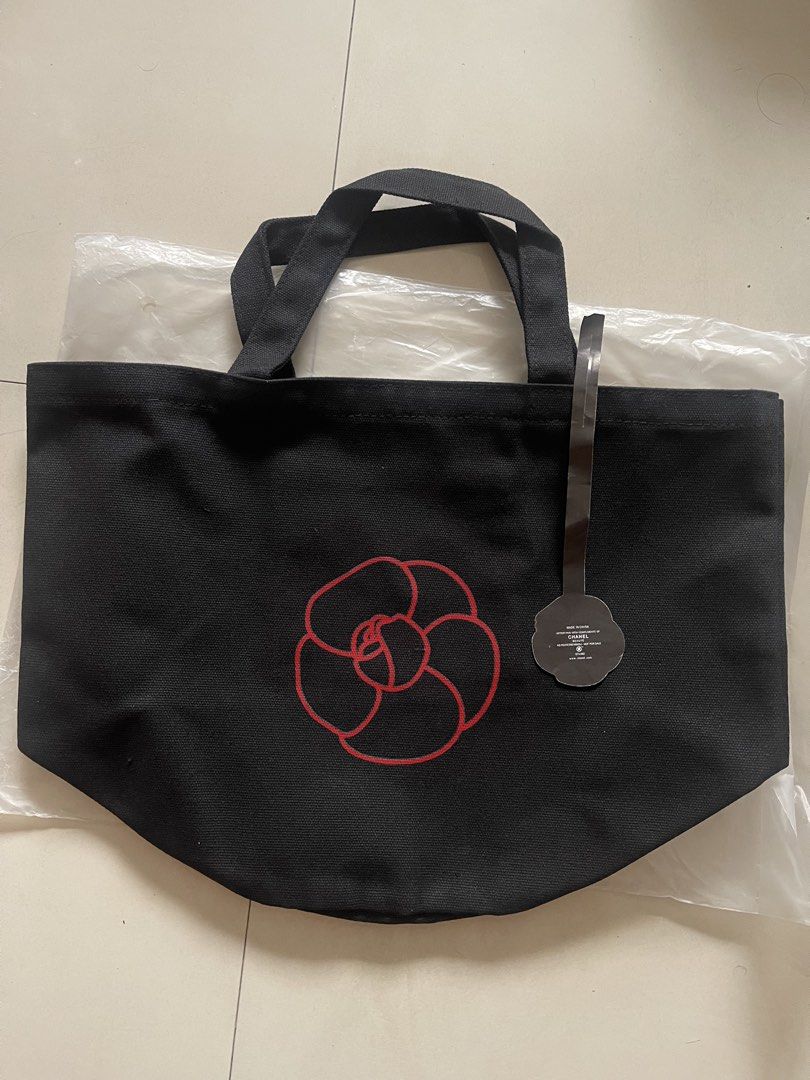 Chanel N°1 De Chanel Canvas Tote Bag (Category: Luxury Bags & Wallets) located in Quezon City. Submitted by kingcurator (Listing ID 1443219230, Image 3). Description: - gift with purchace N°1 De Chanel canvas tote bag - Features the N°1 De Chanel logo on one side - Adorned with a red camellia flower on the other side - Made from 100% high-quality cotton - Includes a convenient inner pocket - Comes with its original tag - Ideal for everyday use an