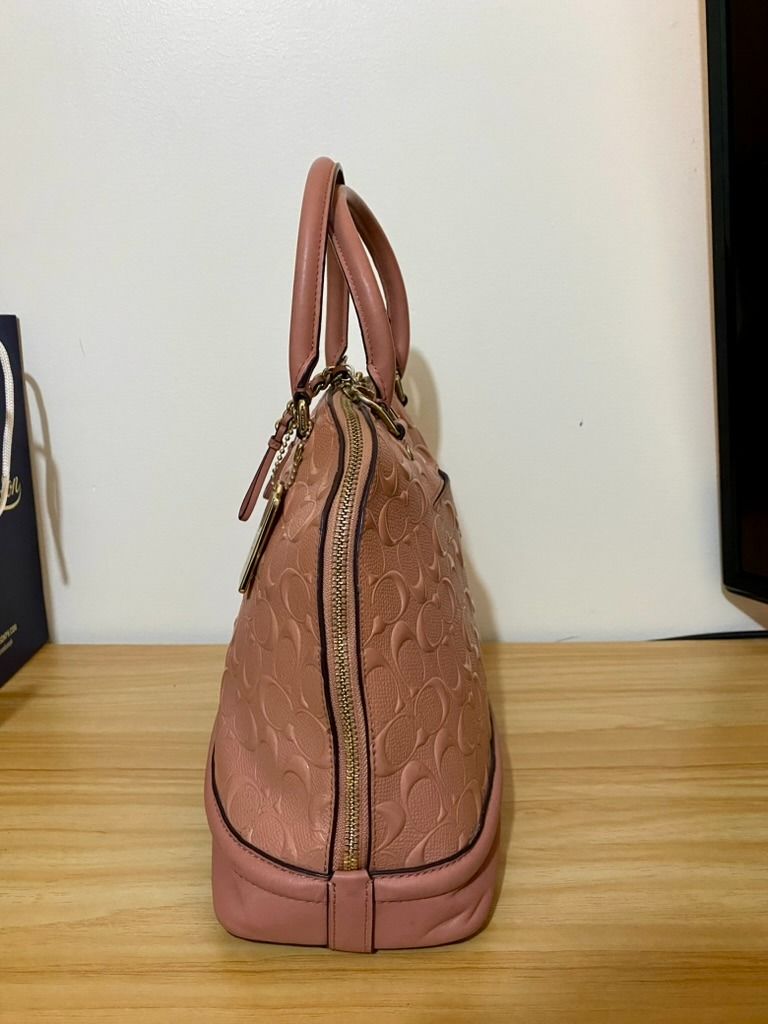 Coach Sierra Satchel Dome Longstrap (Category: Luxury Bags & Wallets) located in Manila. Submitted by kenvalero01923 (Listing ID 1443202465, Image 2). Description: Details: - Color: Blush 🩷 - Material: Signature embossed patent leather - Can be used as a handbag or shoulder bag (with crossbody strap) - 100% authentic Coach (check serial number) [F27598] 📌 Condition: - Bag is still in good condition - Creed/serial tag leather is peeling due to a