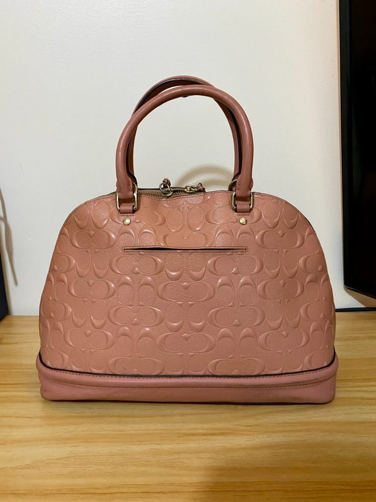 Coach Sierra Satchel Dome Longstrap (Category: Luxury Bags & Wallets) located in Manila. Submitted by kenvalero01923 (Listing ID 1443202465, Image 3). Description: Details: - Color: Blush 🩷 - Material: Signature embossed patent leather - Can be used as a handbag or shoulder bag (with crossbody strap) - 100% authentic Coach (check serial number) [F27598] 📌 Condition: - Bag is still in good condition - Creed/serial tag leather is peeling due to a