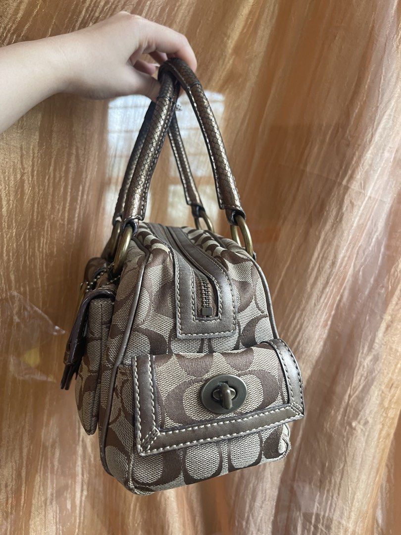 Coach Soho Monogram Canvas & Leather Trimmed Handbag (Category: Luxury Bags & Wallets) located in Davao. Submitted by boodle4lyf (Listing ID 1443196948, Image 3). Description: Classic Coach monogram canvas bag with leather trim and brass hardware. Handles show wear (see pics). Corners are already faded but no rubs or open pipings. Interior is dirty already and needs cleaning. .