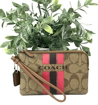 COACH VARSITY STRIPE CORNER ZIP WRISTLET SIGNATURE KHAKI PINK RUBY (Category: Purses & Pouches) located in Manila. Submitted by shoppe_22 (Listing ID 1443192551, Image 1). Description: COACH VARSITY STRIPE CORNER ZIP WRISTLET SIGNATURE KHAKI PINK RUBY bought for $50 at coach outlet store. selling low because i already have too much wallet. slightly negotiable but no lowballers please description: The zip-top closure opens to a fabric-lined interi