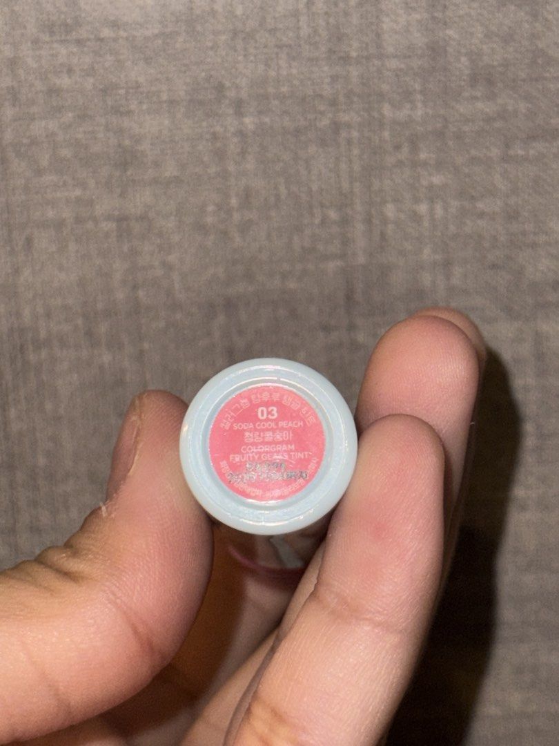 Colorgram Soda Code Peach Fruity Gloss Tint 03 (Category: Makeup) located in Las Pinas. Submitted by coolthreadz (Listing ID 1443300257, Image 2). Description: - Colorgram Lip Tint in shade 03: Soda Code Peach - Type: Fruity Gloss Tint - Finish: Natural glossy lip look - Packaging: Light blue bottle with a pink cap - Features: Easy to carry, perfect for everyday natural makeup - swatched three times! not my shade.
