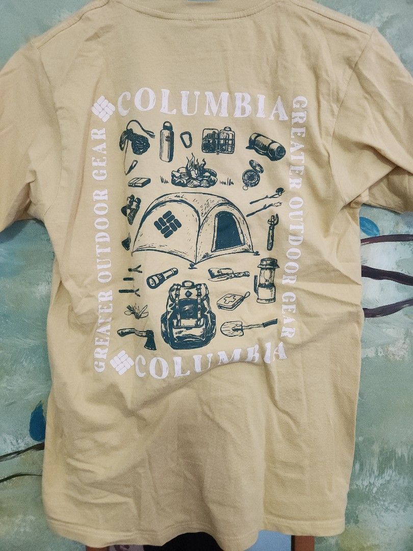 Columbia shirt (Category: Tshirts & Polo Shirts ) located in Makati City. Submitted by abbydeclutters (Listing ID 1443291044, Image 2). Description: - Yellow Columbia shirt w/ graphic print on back - Size: S - With obvious signs of wear.