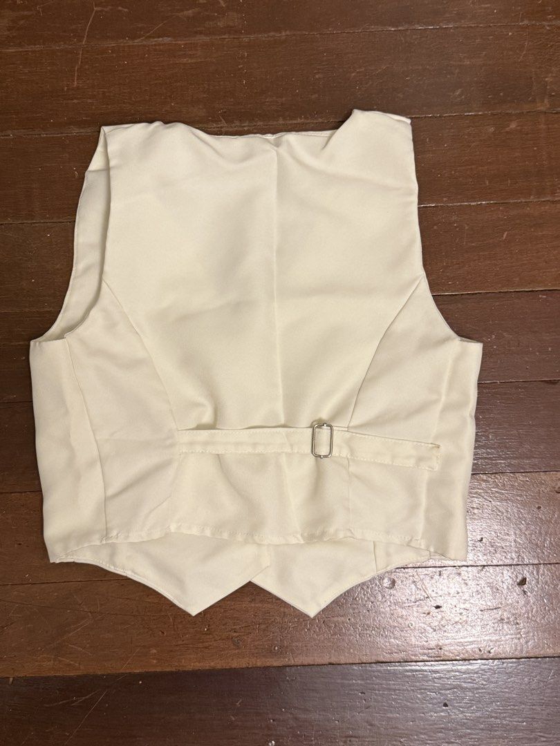 Cream Button-Up Vest (Category: Vests) located in Angeles City. Submitted by lesmiz24601 (Listing ID 1443171104, Image 2). Description: - Cream colored vest - Button front closure - Adjustable strap at the back - Cropped fit - Ideal for layering over shirts or dresses Ig: notspringbutcleaning.
