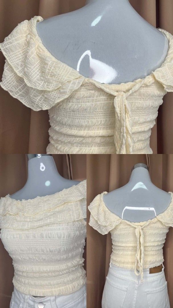Cream Off-Shoulder Smocked Ruffle Crop Top (Category: Others Tops) located in Manila. Submitted by moon.sage (Listing ID 1443196604, Image 2). Description: - Cute cream off-shoulder top - Smocked body for a flattering fit - Ruffle details on neckline and sleeves - Adjustable tie-back detail - Very stretchy and comfortable material - Pairs perfectly with high-waisted jeans or skirts.