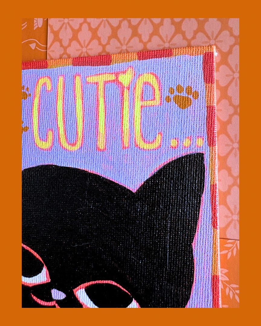 Cute Black Cat Acrylic Painting on Canvas Panel (Category: Art & Prints) located in Taguig. Submitted by lyracb (Listing ID 1443273349, Image 2). Description: - Hand-painted acrylic art on a 5x7 inch canvas panel. - Features a black cat with ' CUTIE...' text and paw prints. - Soft lavender background with a decorative border. - Perfect for cat lovers and adding a unique touch to your decor. - Unique wall art piece..